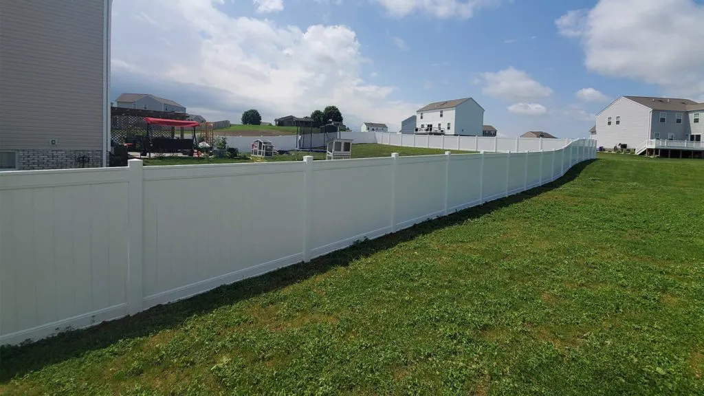 white vinyl fence and green grass aliquippa pa 1024x576 1